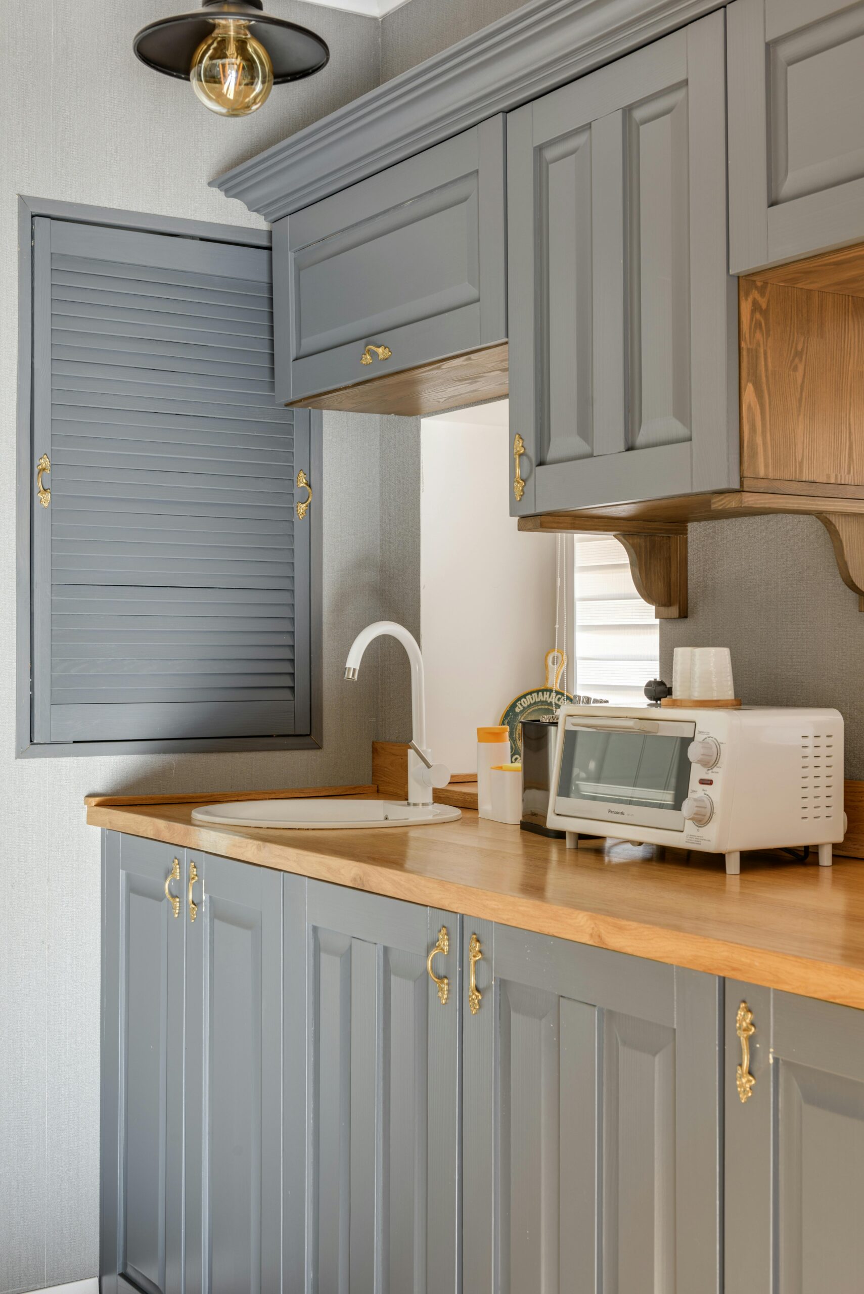 Freshly refinished kitchen cabinets in a bright modern space